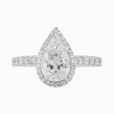 Diamond ring with pear-shaped center stone on a white background